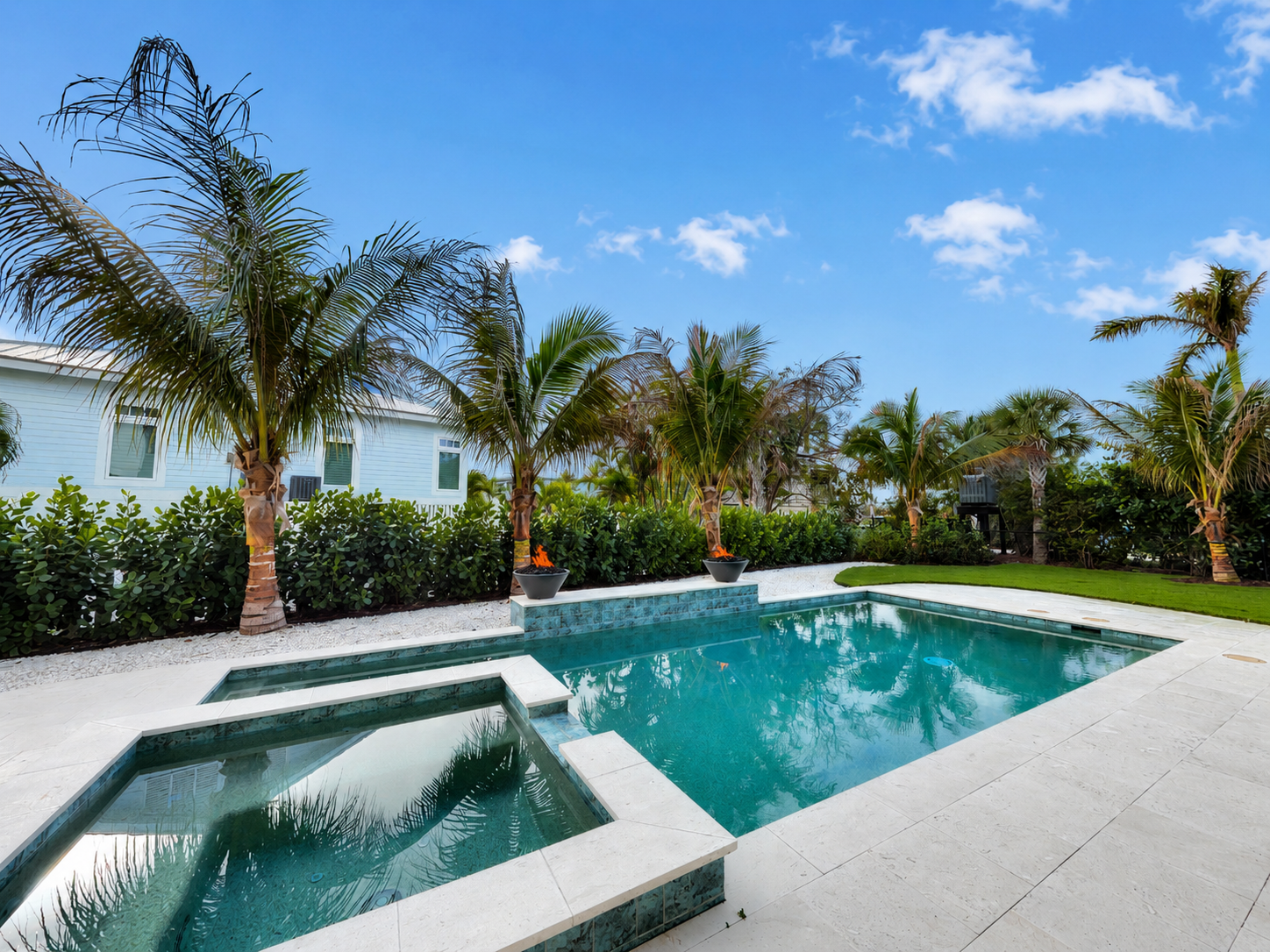 Sky replacement before and after for a pool and palm tree listing photo after